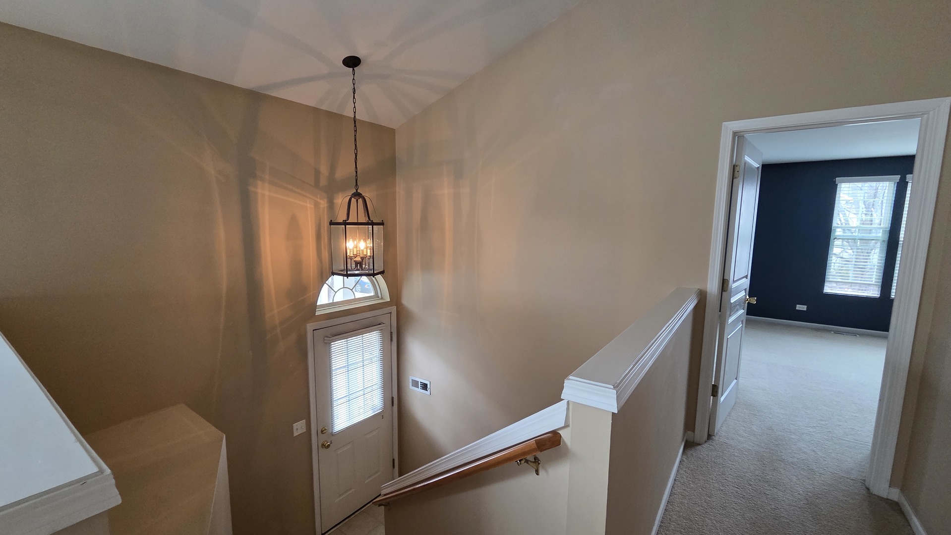 2444 Emily Lane, Unit 2444 Elgin, IL 60124 - Photo 16 of 22 a view of a hallway with wooden floor and stairs