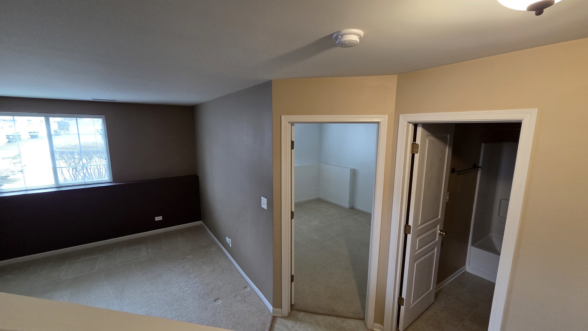 2444 Emily Lane, Unit 2444 Elgin, IL 60124 - Photo 17 of 22 a view of an empty room and a window