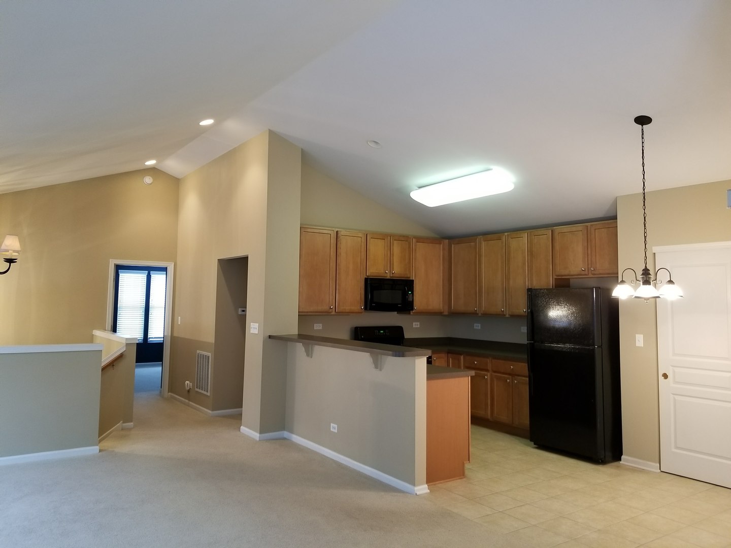 2444 Emily Lane, Unit 2444 Elgin, IL 60124 - Photo 2 of 22 a kitchen with stainless steel appliances a refrigerator sink and microwave