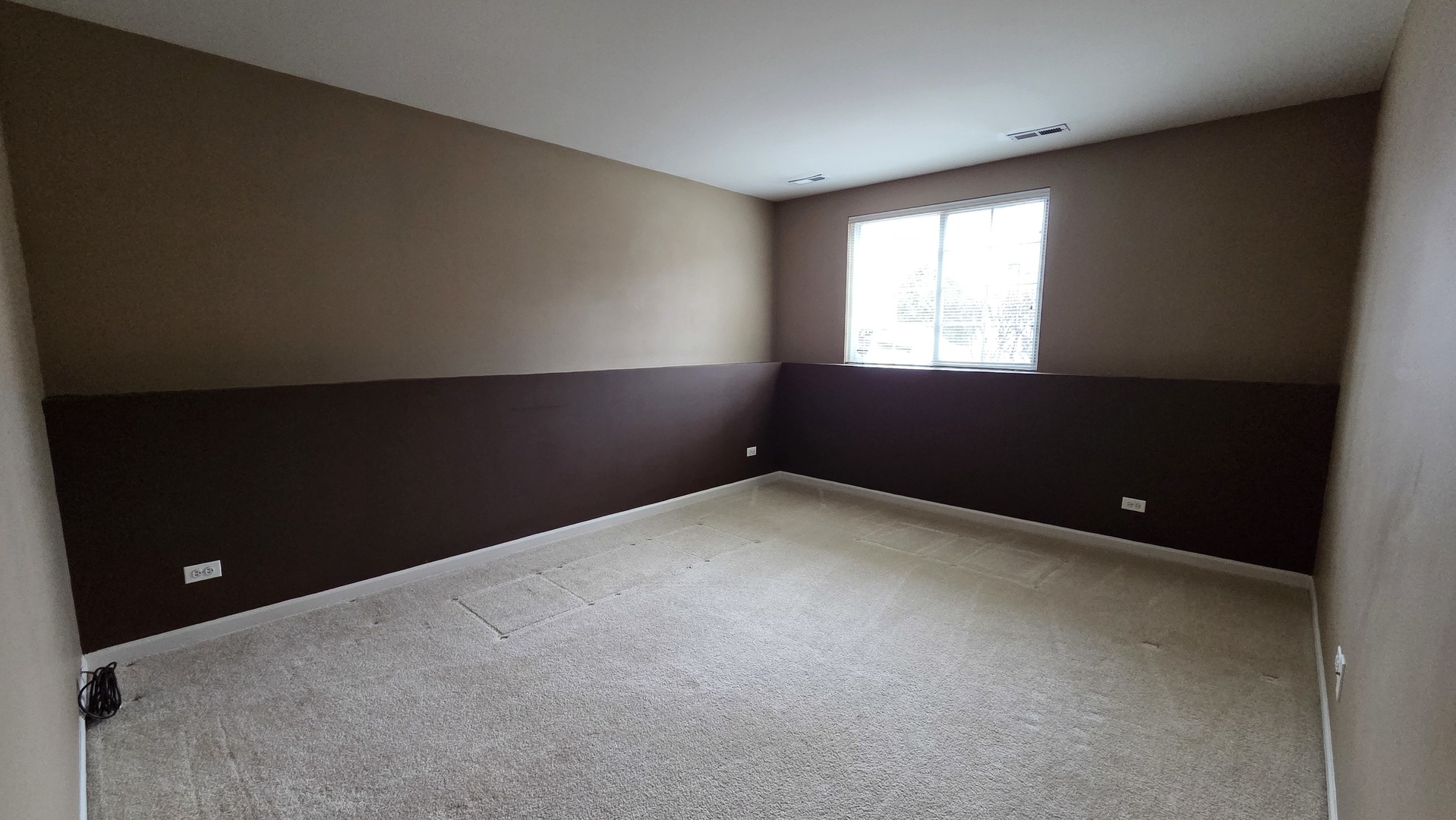 2444 Emily Lane, Unit 2444 Elgin, IL 60124 - Photo 21 of 22 a view of an empty room with a window