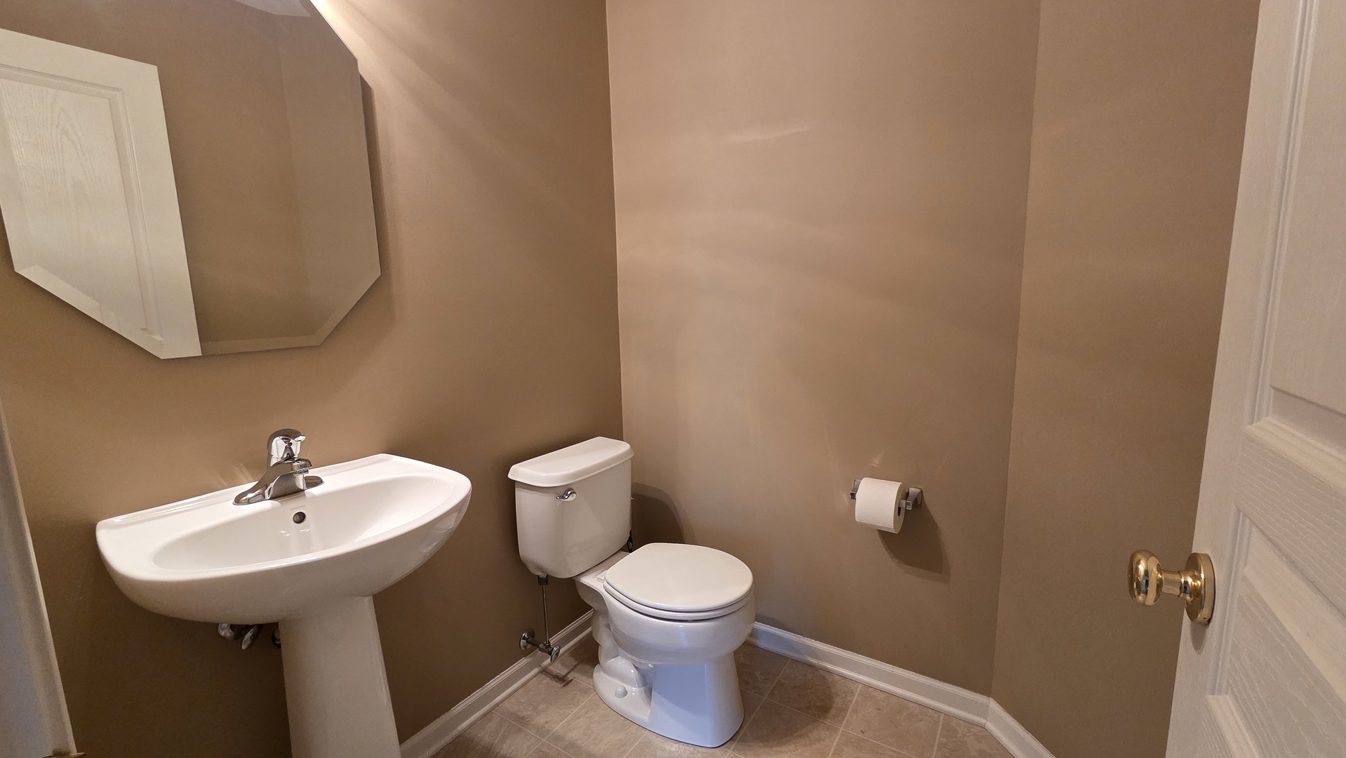 2444 Emily Lane, Unit 2444 Elgin, IL 60124 - Photo 22 of 22 a bathroom with a toilet sink and mirror