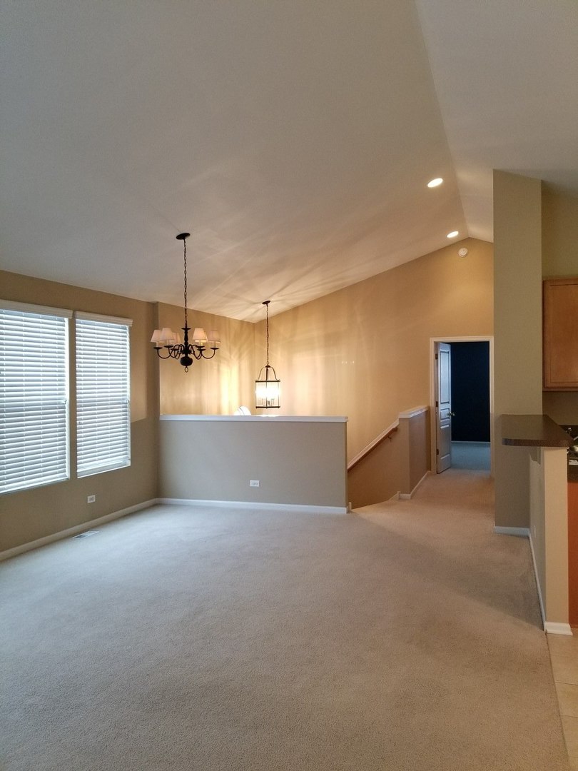 2444 Emily Lane, Unit 2444 Elgin, IL 60124 - Photo 3 of 22 a view of an empty room with a window