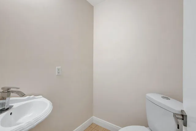 a bathroom with a toilet and sink
