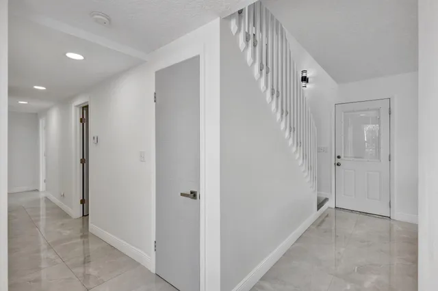 a view of a hallway with closet area