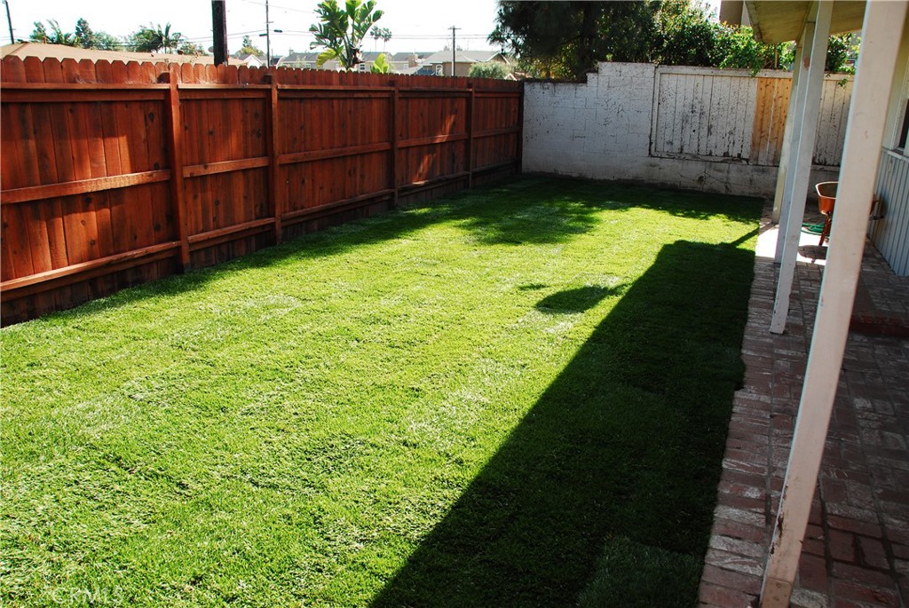 Undisclosed Address Costa Mesa, CA 92627 - Photo 12 of 16 a view of a backyard with wooden fence