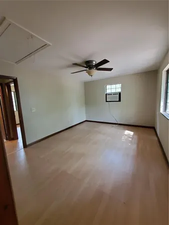 a view of a garage with wooden floor