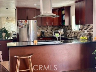 219 Lema Drive Nipomo, CA 93444 - Photo 11 of 26 a kitchen with a sink and a refrigerator