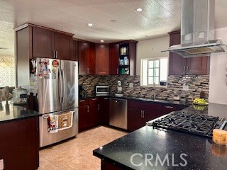 219 Lema Drive Nipomo, CA 93444 - Photo 13 of 26 a kitchen with stainless steel appliances granite countertop a refrigerator a stove and a sink