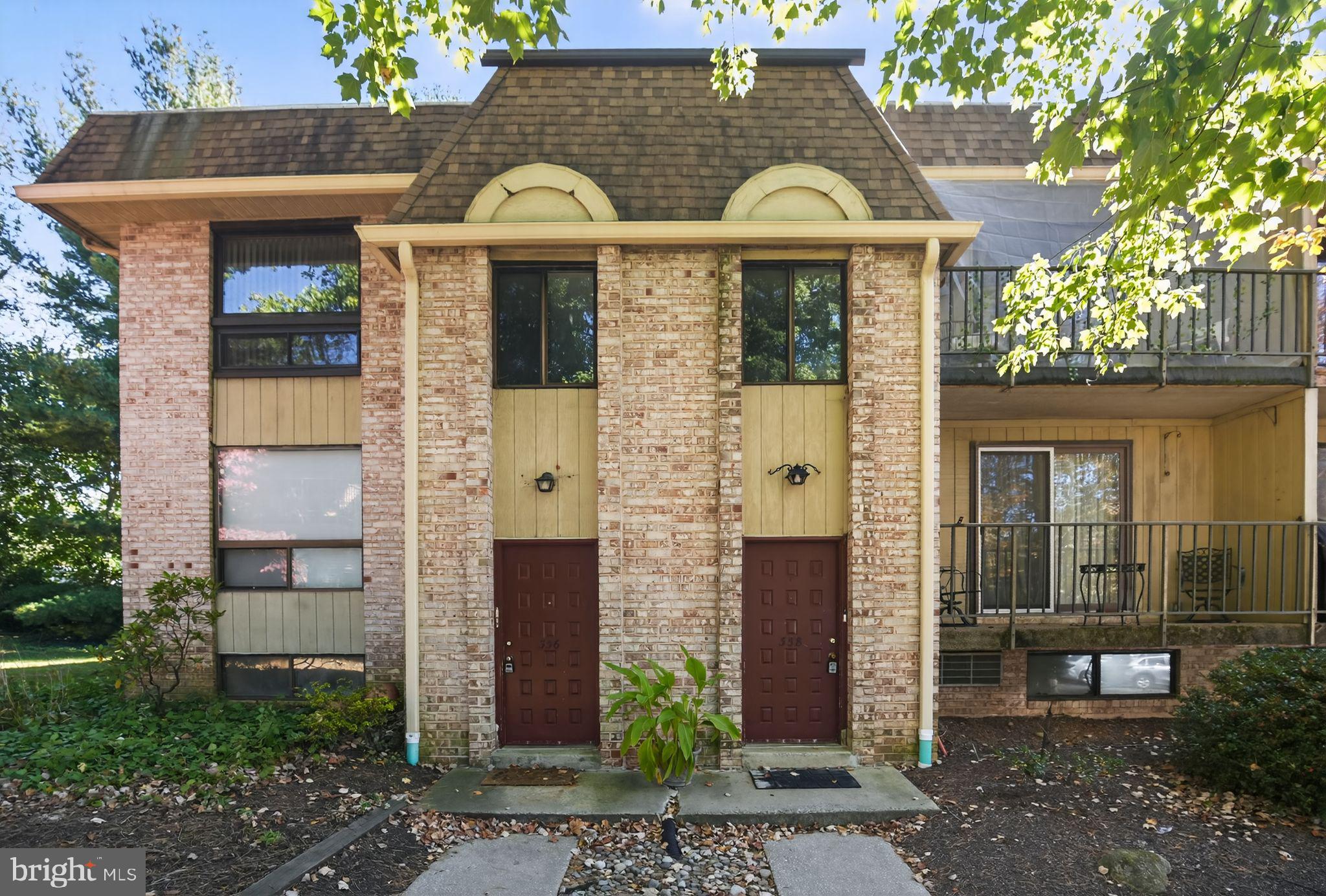 356 B Saybrook Lane, Unit B Wallingford, PA 19086 - Photo 3 of 34 a front view of a house with garden