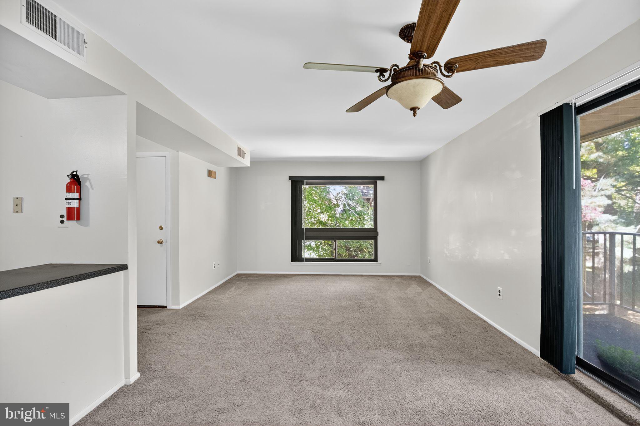 356 B Saybrook Lane, Unit B Wallingford, PA 19086 - Photo 6 of 34 a view of an empty room with a window