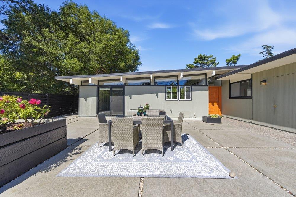 2203 Allegheny Way San Mateo, CA 94402 - Photo 34 of 56 a view of a patio with table and chairs and potted plants
