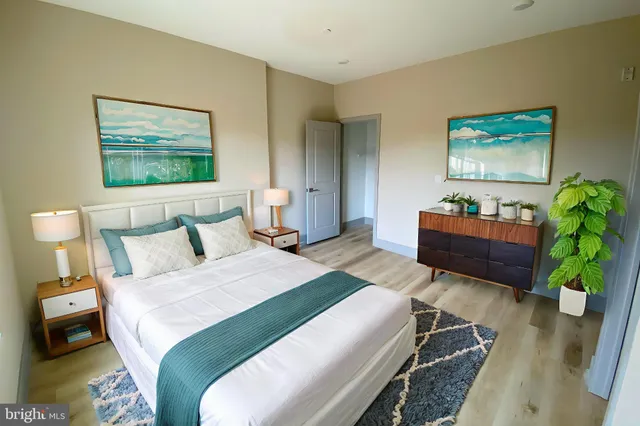 a bedroom with a bed and a couch