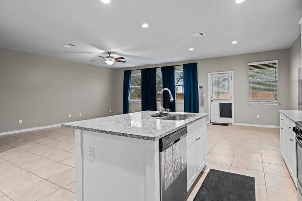 a kitchen with a sink a stove and refrigerator