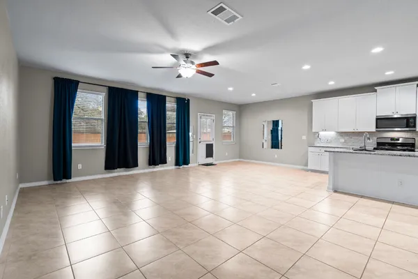 a view of a kitchen counter space and windows