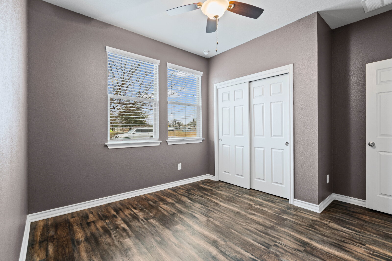 204 Tulum Terrace Leander, TX 78641 - Photo 15 of 22 a view of room with window ceiling fan and hardwood floor