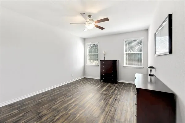 a kitchen with sink stove and microwave