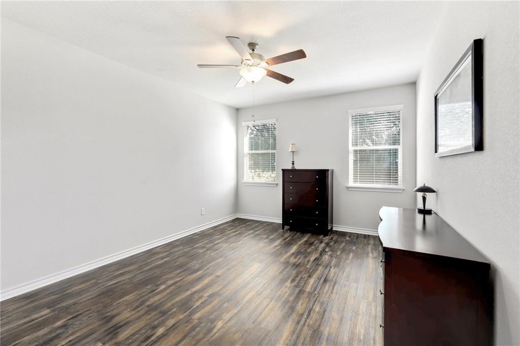 204 Tulum Terrace Leander, TX 78641 - Photo 4 of 22 a workspace with wooden floor and windows