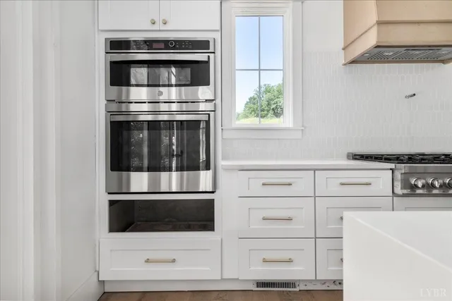a bathroom with a sink and vanity