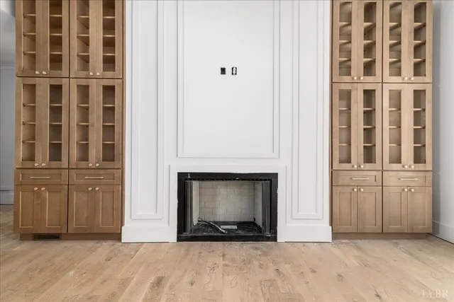 a view of a dining room with furniture wooden floor and chandelier