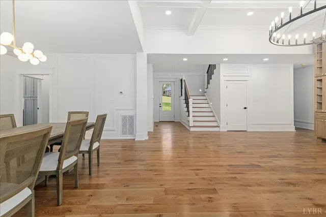 a kitchen with white cabinets and appliances