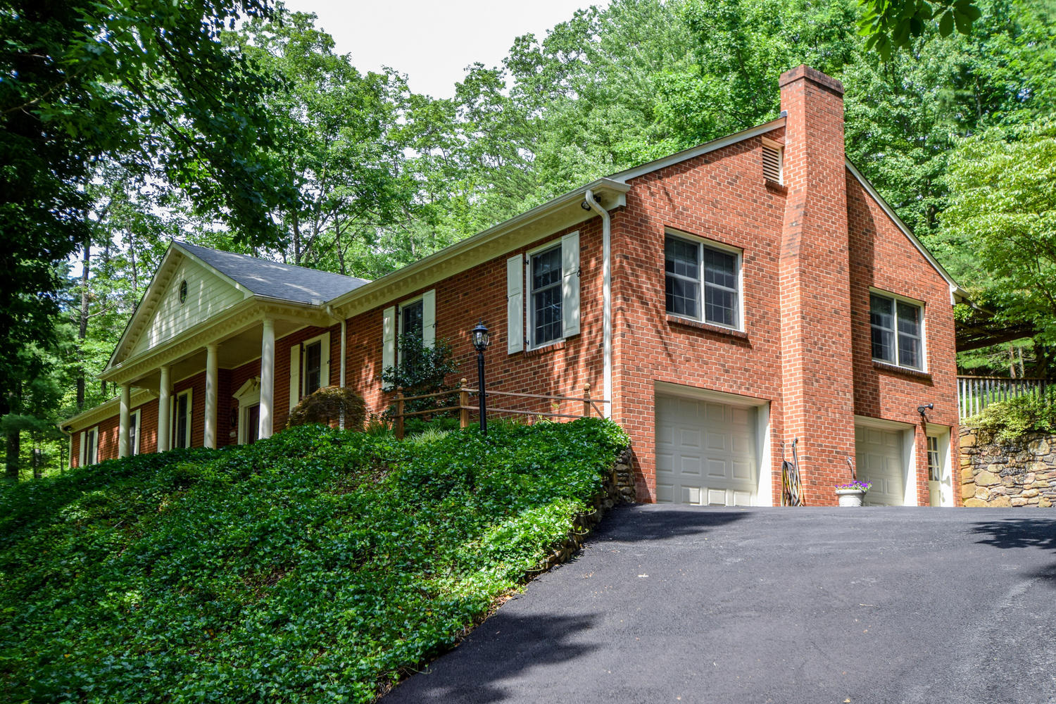 4848 Deerfield Road Southwest Roanoke, VA 24018 - Photo 1 of 59 a front view of a house with a yard and trees