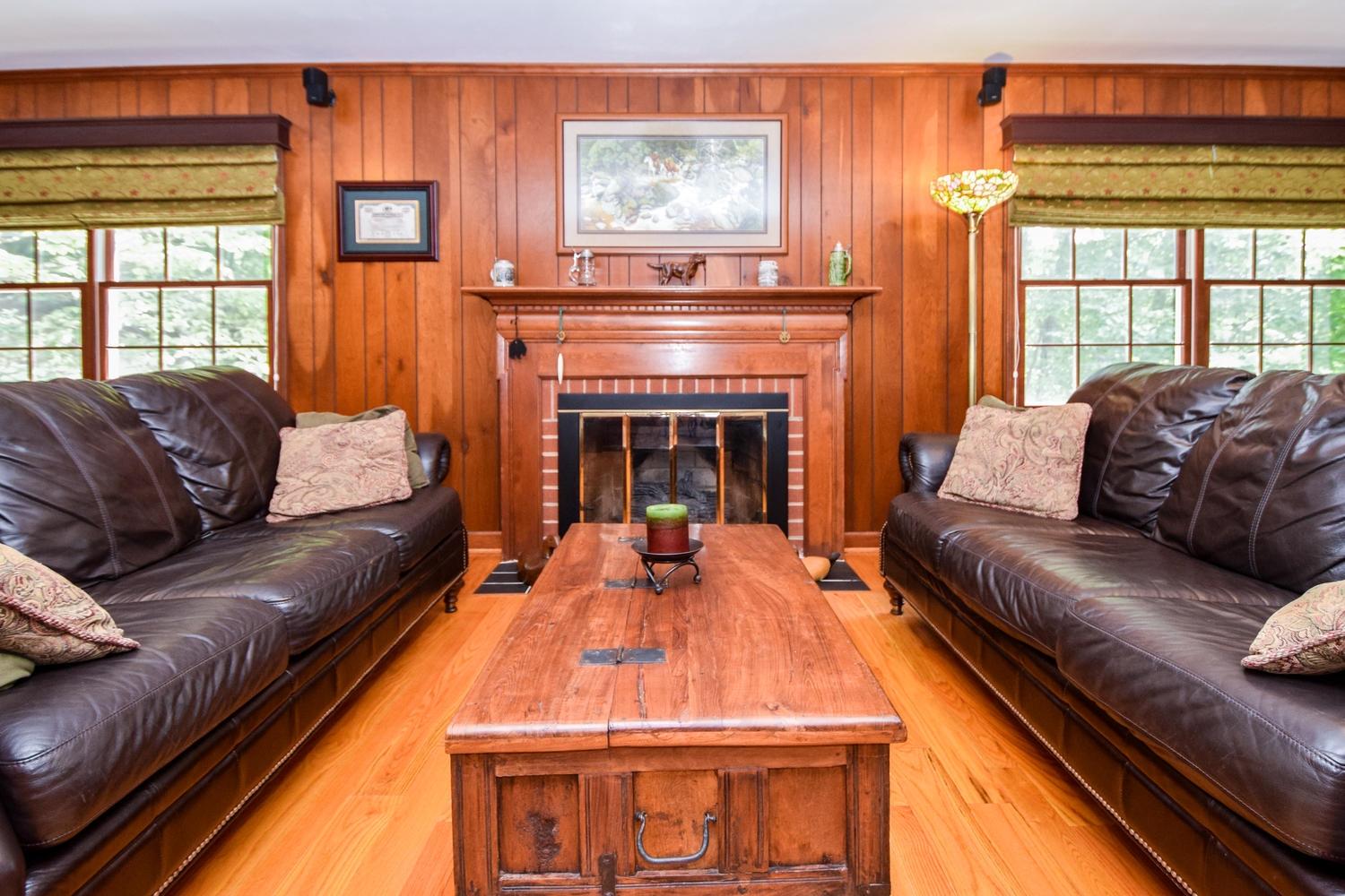 4848 Deerfield Road Southwest Roanoke, VA 24018 - Photo 14 of 59 a living room with furniture and a fireplace