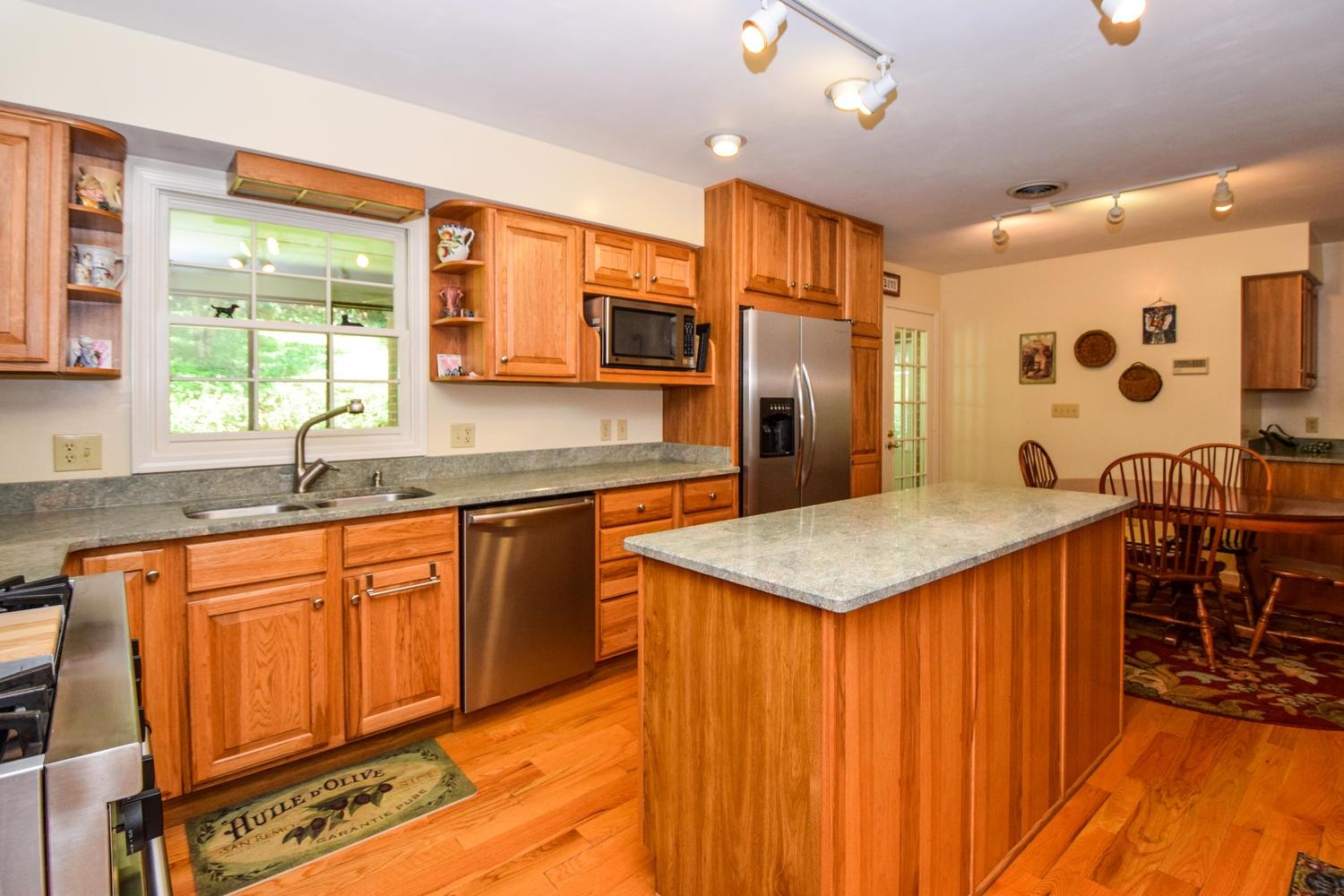 4848 Deerfield Road Southwest Roanoke, VA 24018 - Photo 21 of 59 a kitchen with stainless steel appliances granite countertop a sink and cabinets