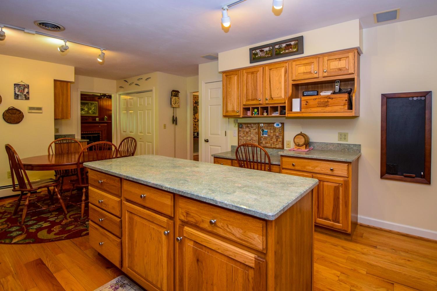4848 Deerfield Road Southwest Roanoke, VA 24018 - Photo 22 of 59 a room with stainless steel appliances granite countertop a sink and a refrigerator