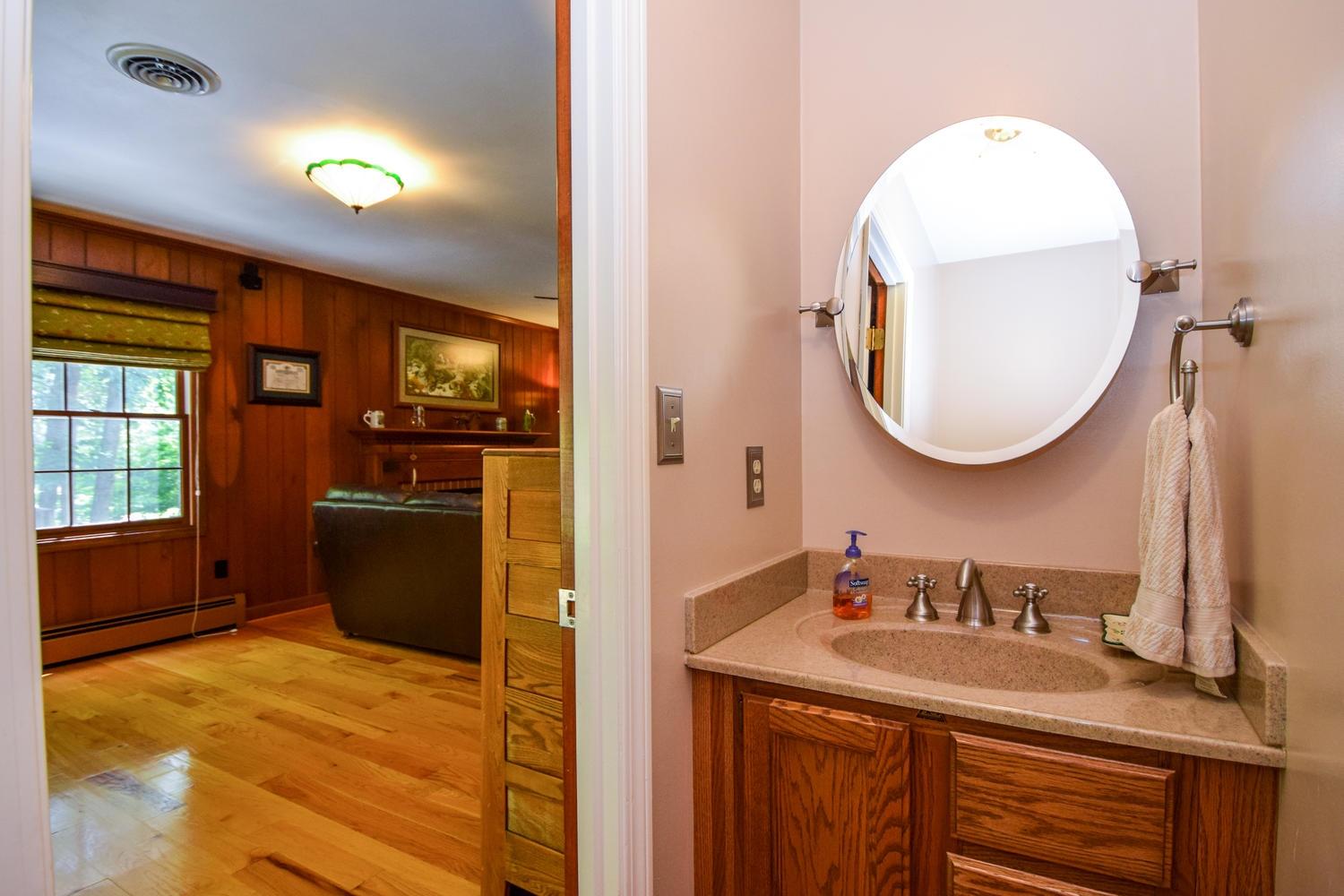 4848 Deerfield Road Southwest Roanoke, VA 24018 - Photo 23 of 59 a bathroom with a sink and a mirror