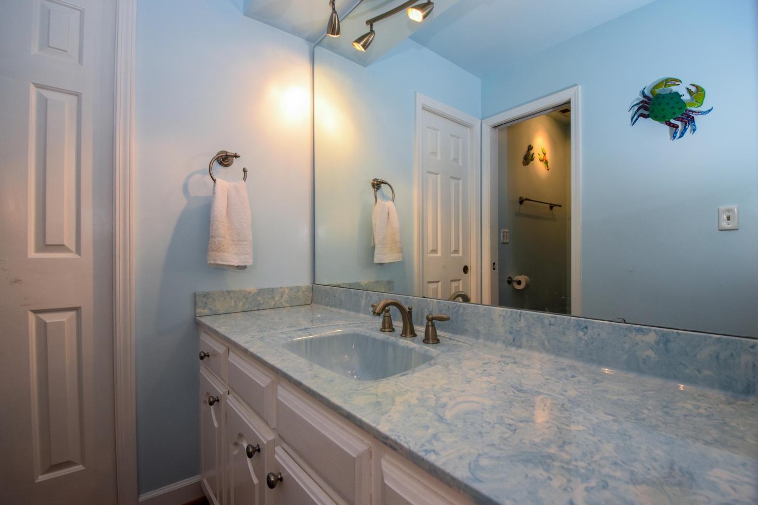 4848 Deerfield Road Southwest Roanoke, VA 24018 - Photo 30 of 59 a bathroom with a sink and a mirror