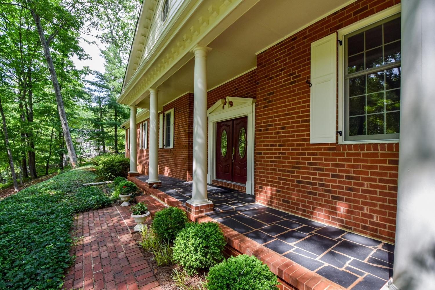 4848 Deerfield Road Southwest Roanoke, VA 24018 - Photo 5 of 59 a front view of a house with a yard