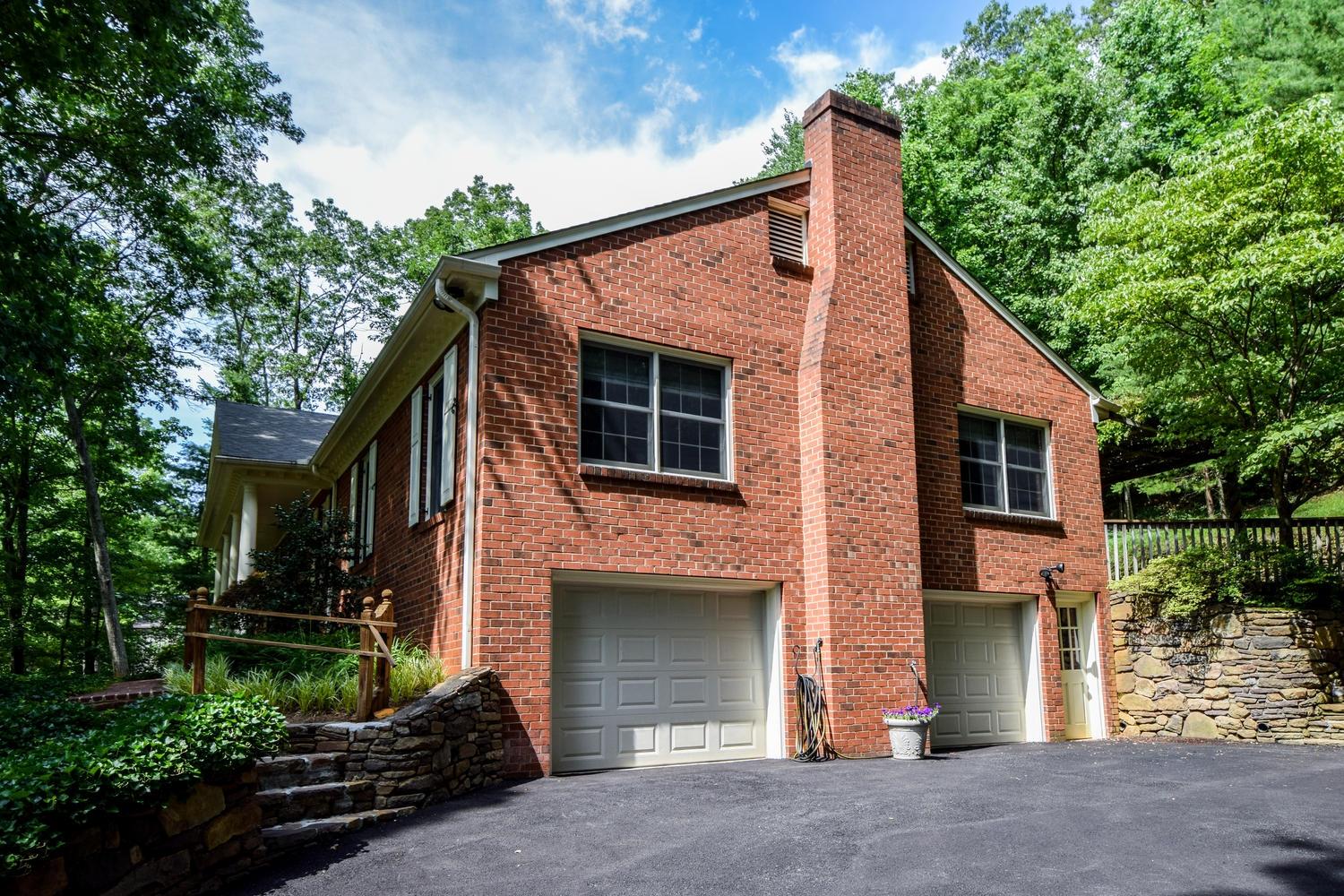 4848 Deerfield Road Southwest Roanoke, VA 24018 - Photo 46 of 59 a front view of a house with a garden