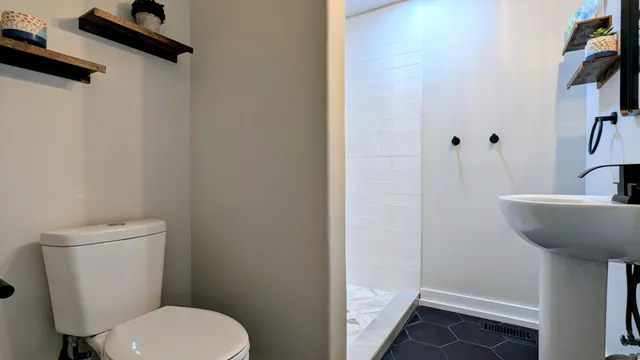 a bathroom with a toilet and a sink