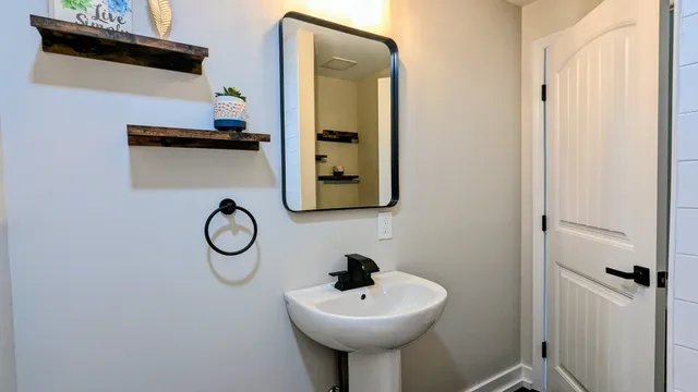 a bathroom with a sink and a mirror