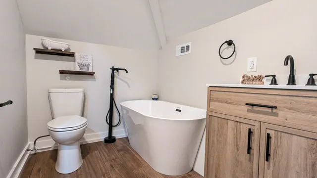a bathroom with a sink and toilet