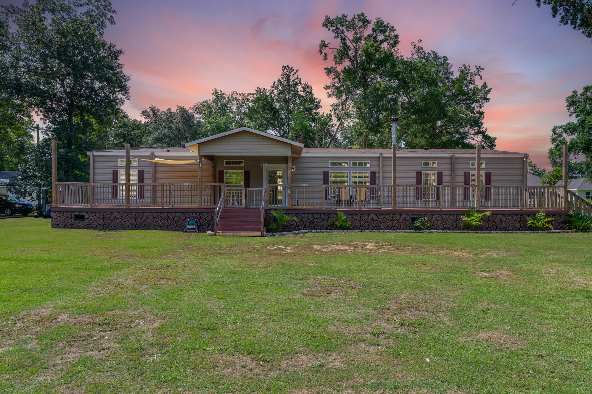 508 Live Oak Street Freeport, FL 32439 - Photo 1 of 47 a view of a house with a backyard and a patio