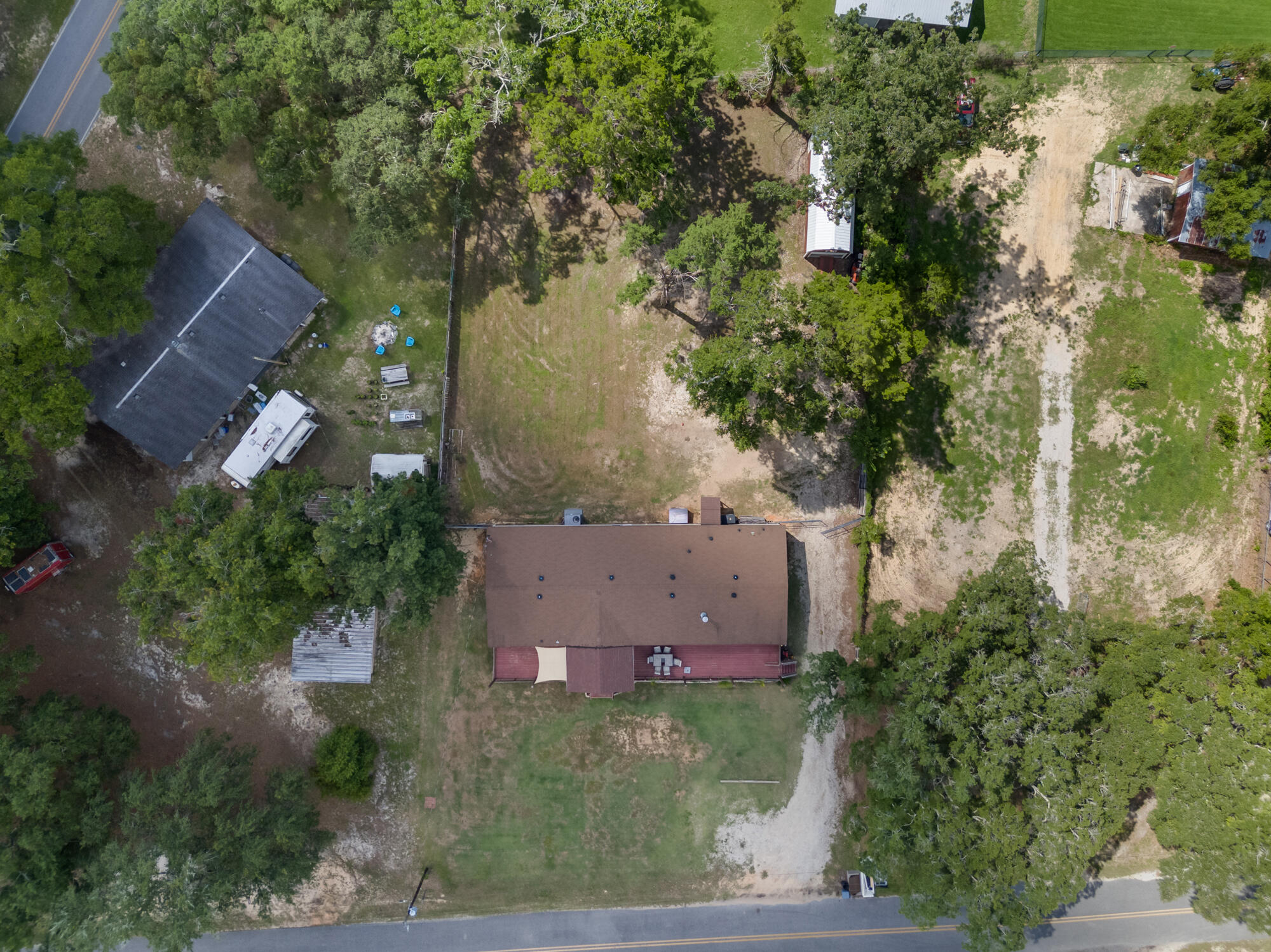 508 Live Oak Street Freeport, FL 32439 - Photo 12 of 47 an aerial view of residential house with outdoor space and trees all around