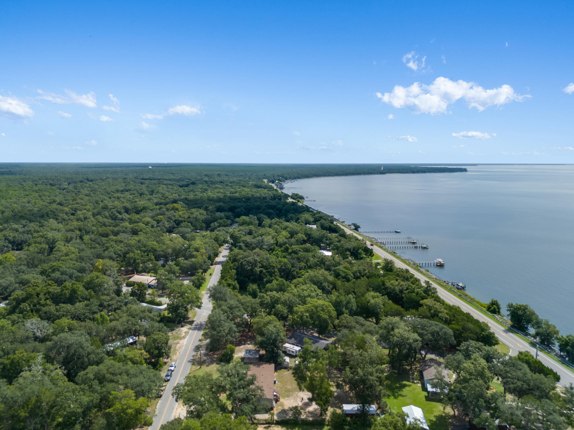 508 Live Oak Street Freeport, FL 32439 - Photo 17 of 47 a view of a lake with a city