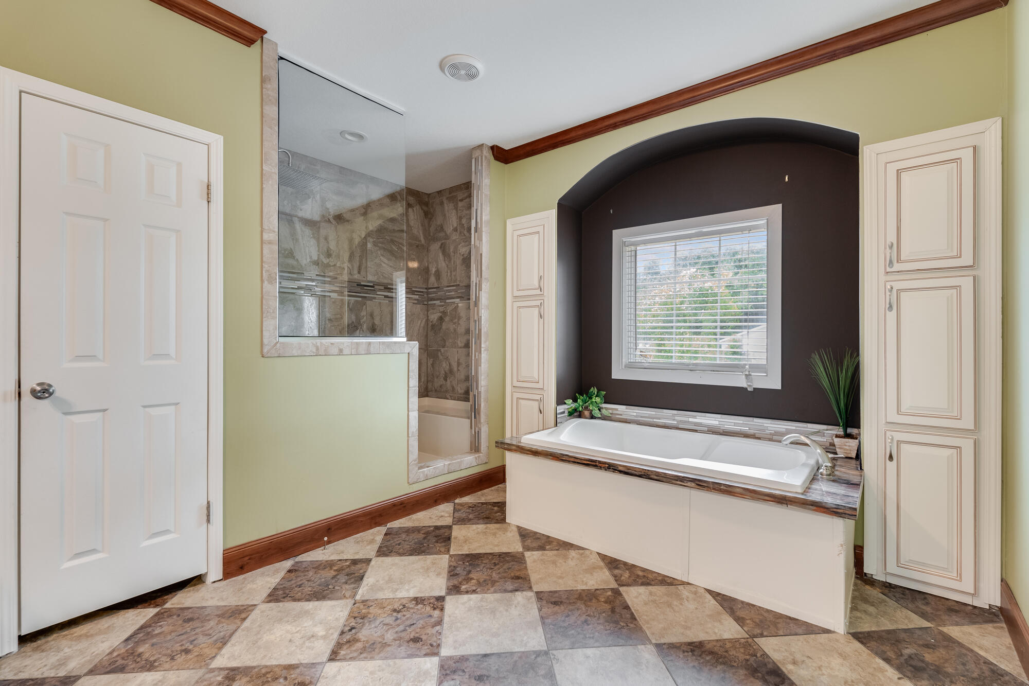 508 Live Oak Street Freeport, FL 32439 - Photo 21 of 47 a spacious bathroom with a bathtub and a shower