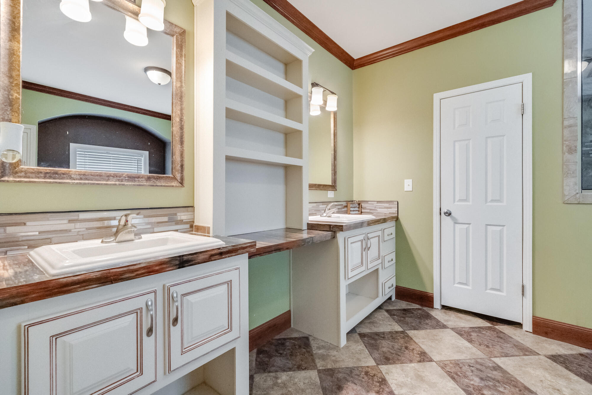 508 Live Oak Street Freeport, FL 32439 - Photo 22 of 47 a spacious bathroom with a double vanity sink and a mirror
