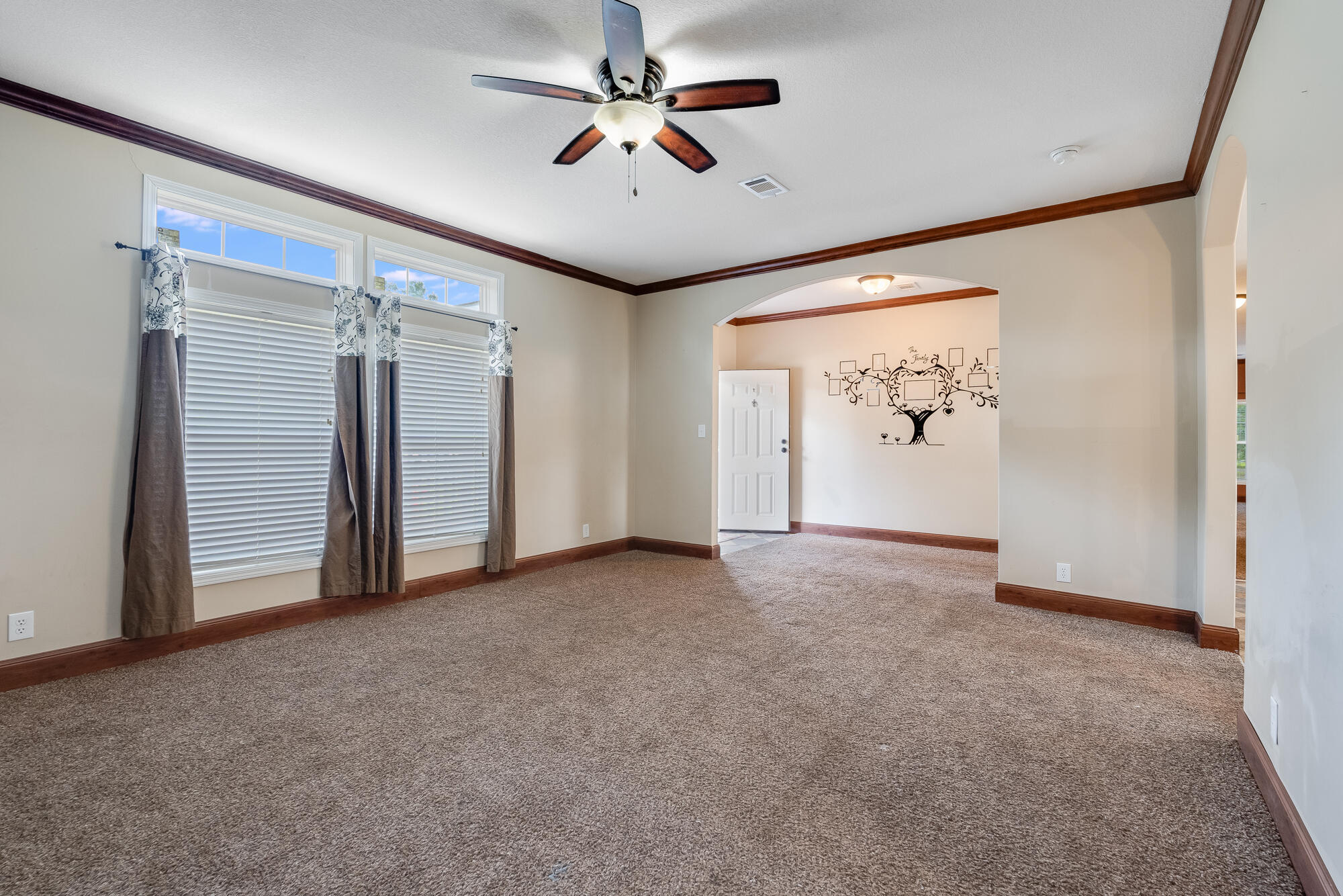 508 Live Oak Street Freeport, FL 32439 - Photo 25 of 47 an empty room with windows and fan