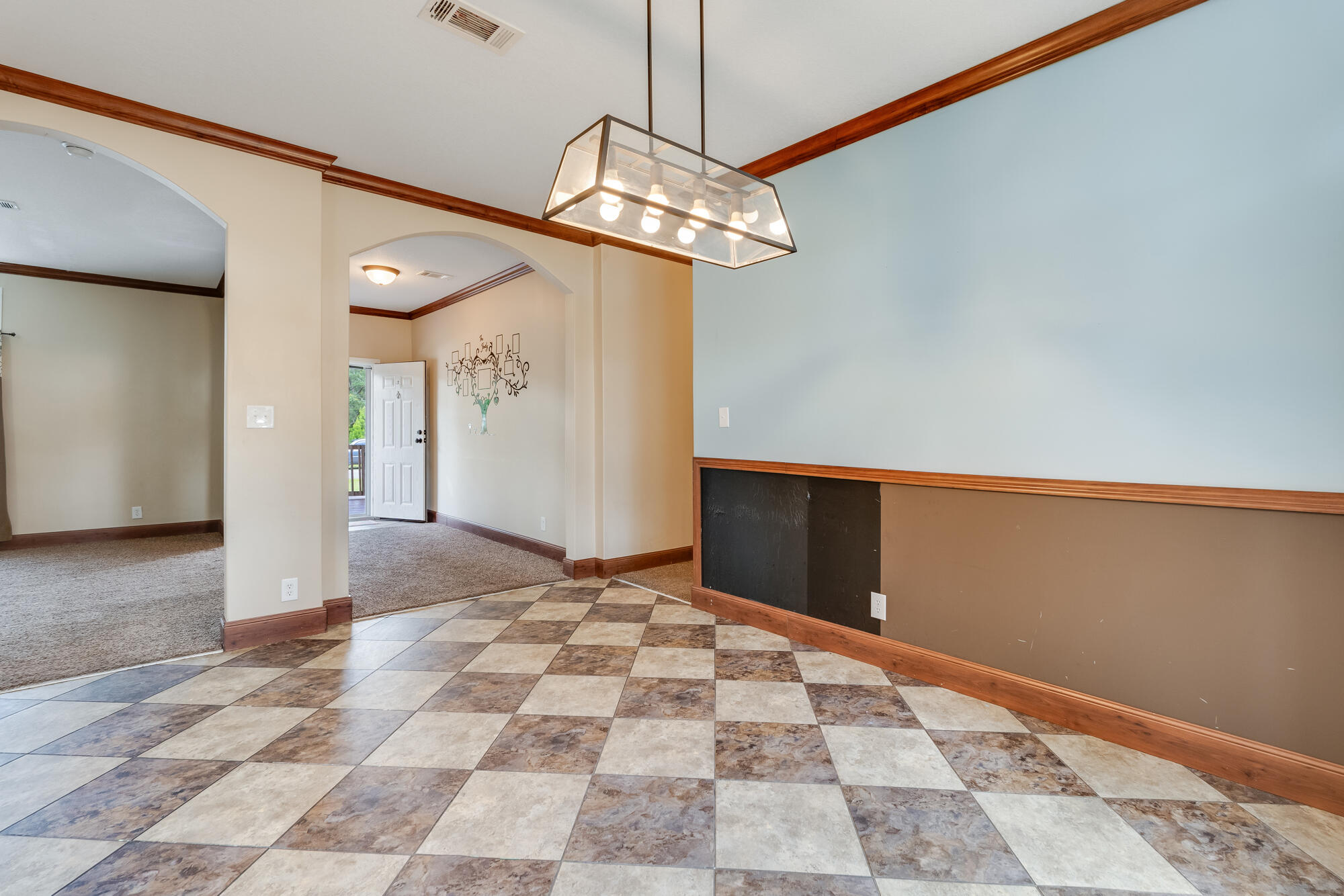 508 Live Oak Street Freeport, FL 32439 - Photo 27 of 47 a view of a hallway with a chandelier