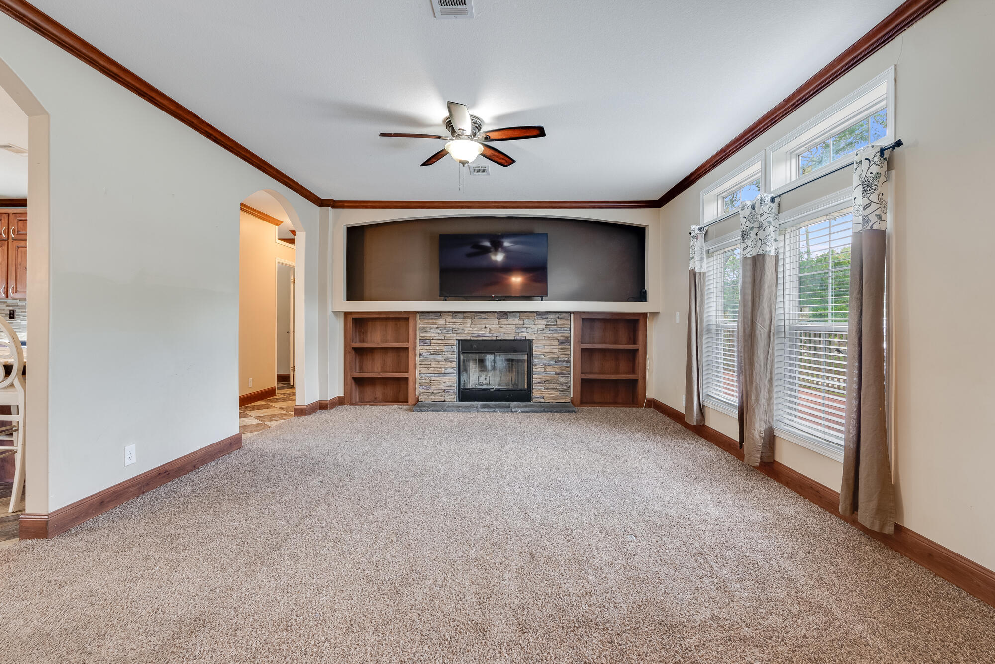 508 Live Oak Street Freeport, FL 32439 - Photo 28 of 47 a view of an empty room with a fireplace and a window
