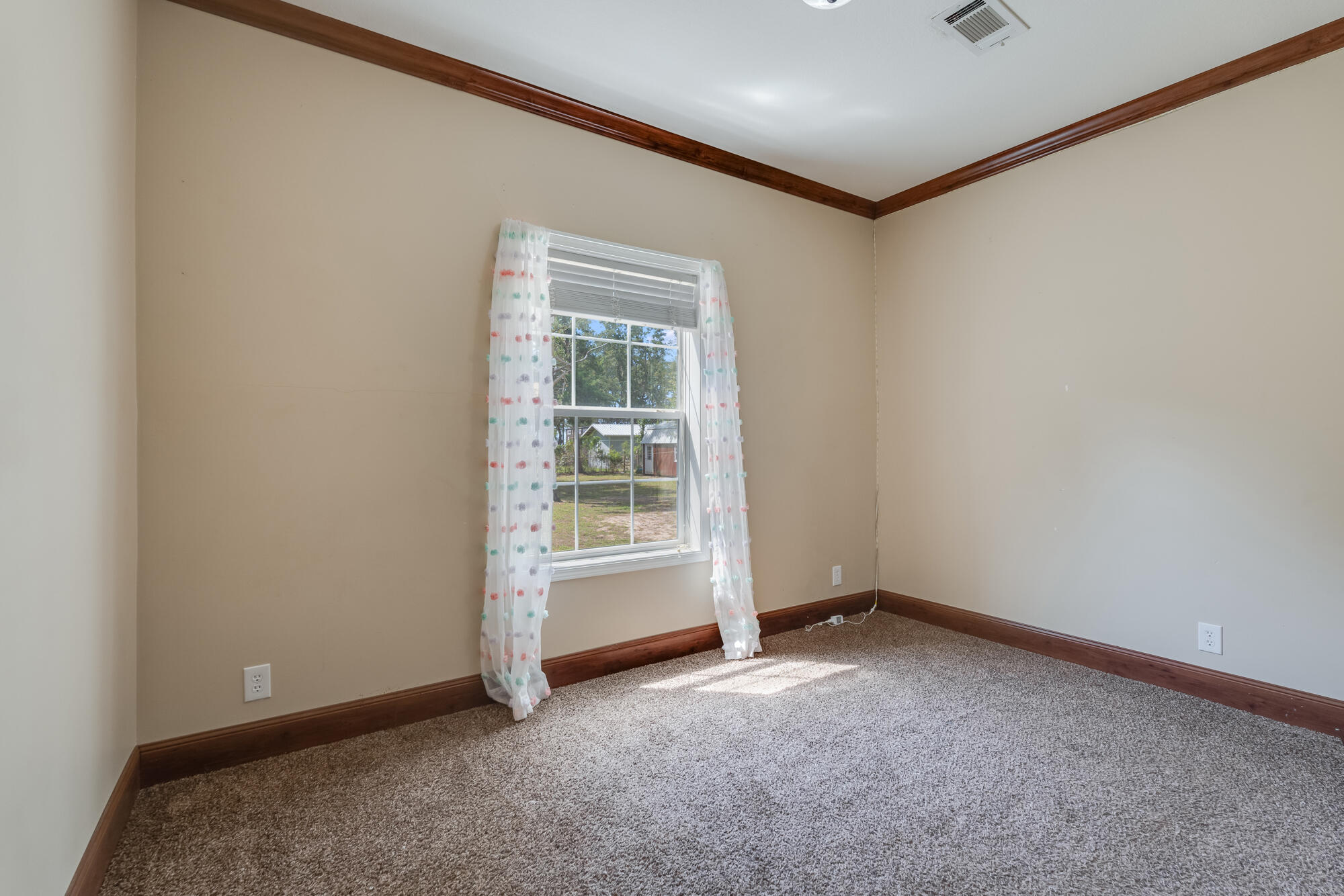 508 Live Oak Street Freeport, FL 32439 - Photo 32 of 47 an empty room with a empty space and a window
