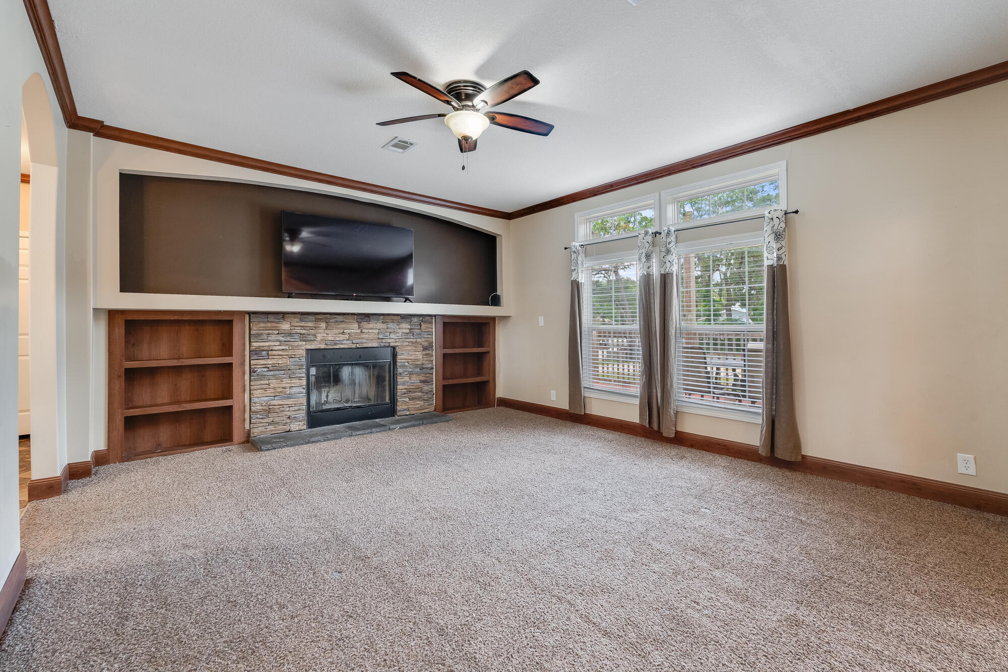 508 Live Oak Street Freeport, FL 32439 - Photo 45 of 47 a view of an empty room with a fireplace and a window