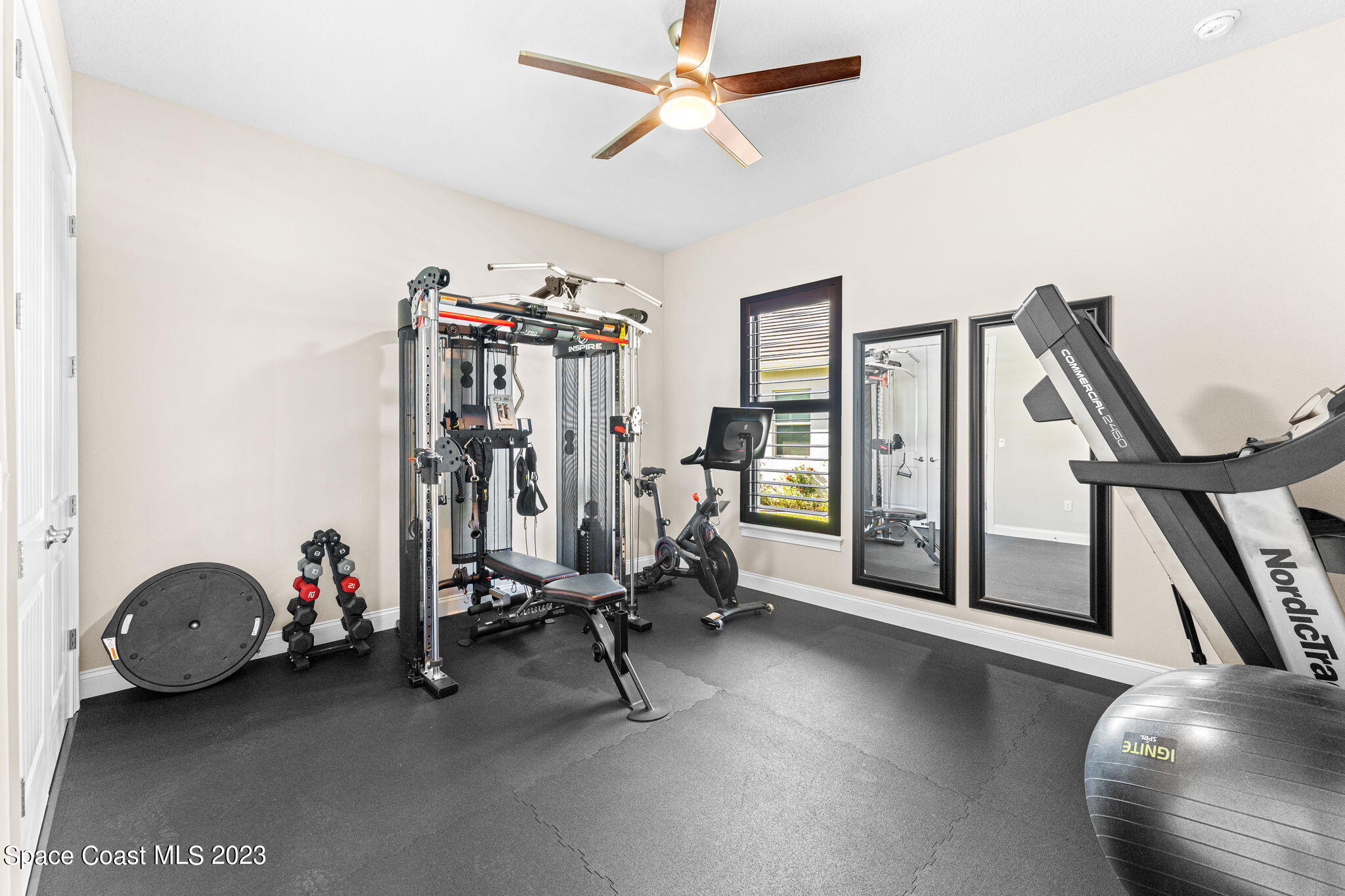 8429 Serrano Circle Melbourne, FL 32940 - Photo 13 of 28 a view of a room with gym equipment