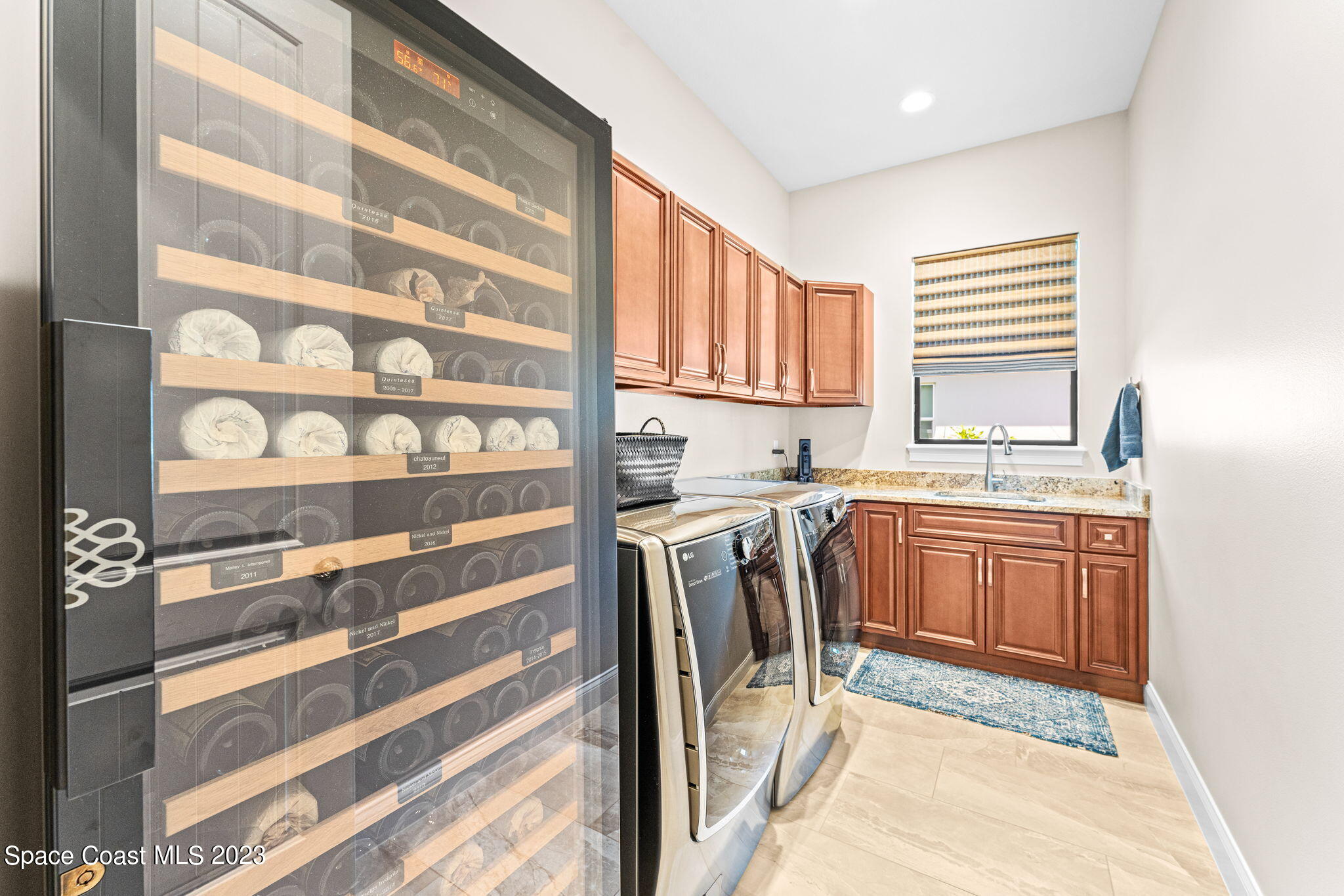 8429 Serrano Circle Melbourne, FL 32940 - Photo 15 of 28 a kitchen with a sink window and cabinets