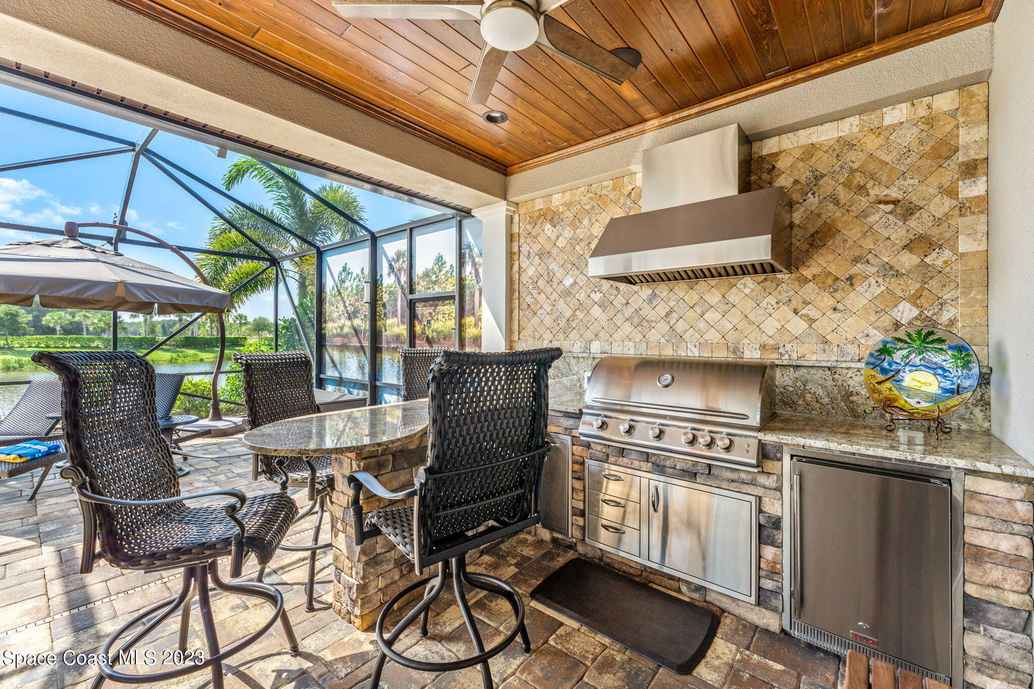 8429 Serrano Circle Melbourne, FL 32940 - Photo 16 of 28 a kitchen with a stove and chairs