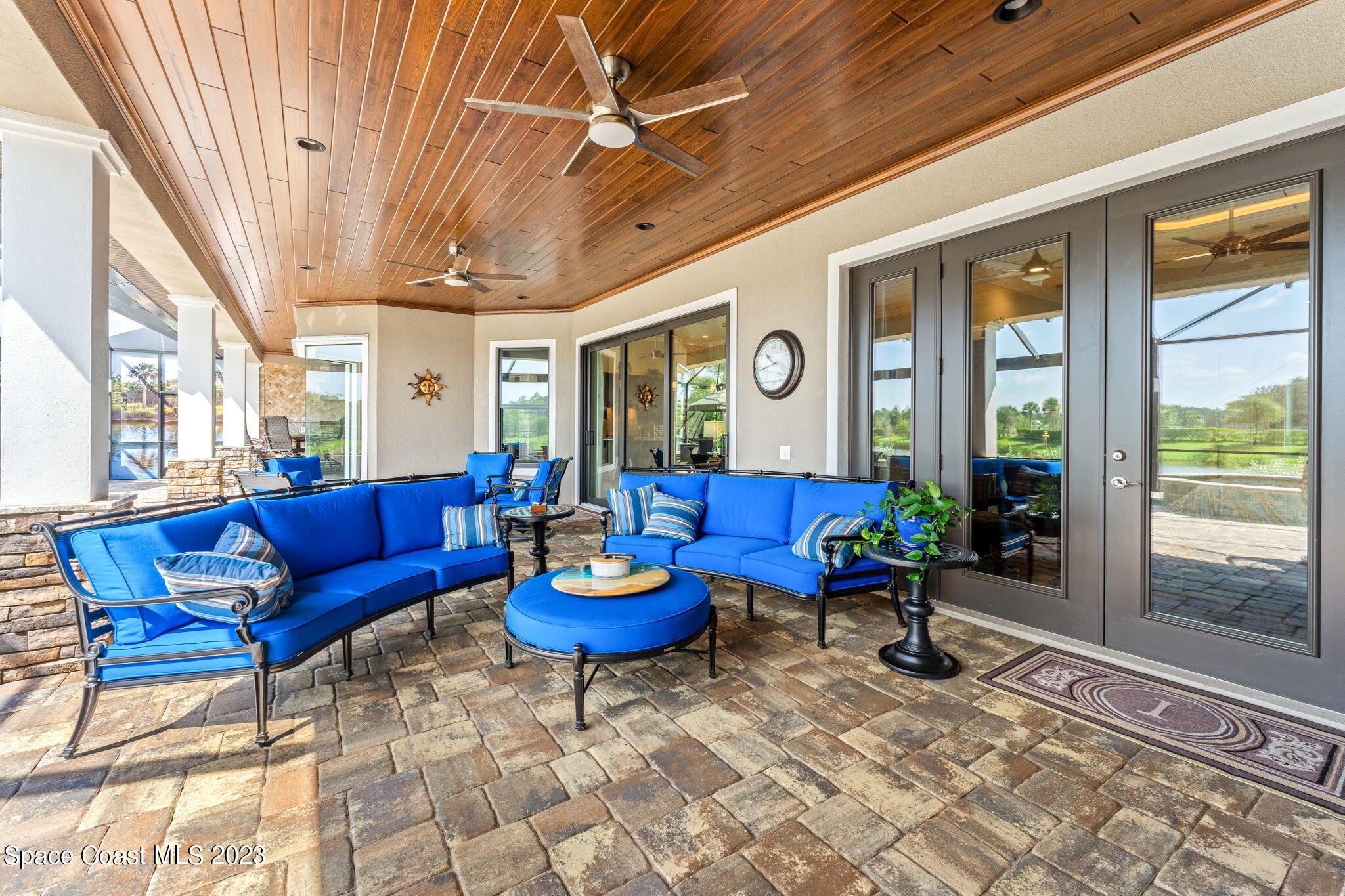 8429 Serrano Circle Melbourne, FL 32940 - Photo 17 of 28 a living room with furniture a wooden floor and a large window
