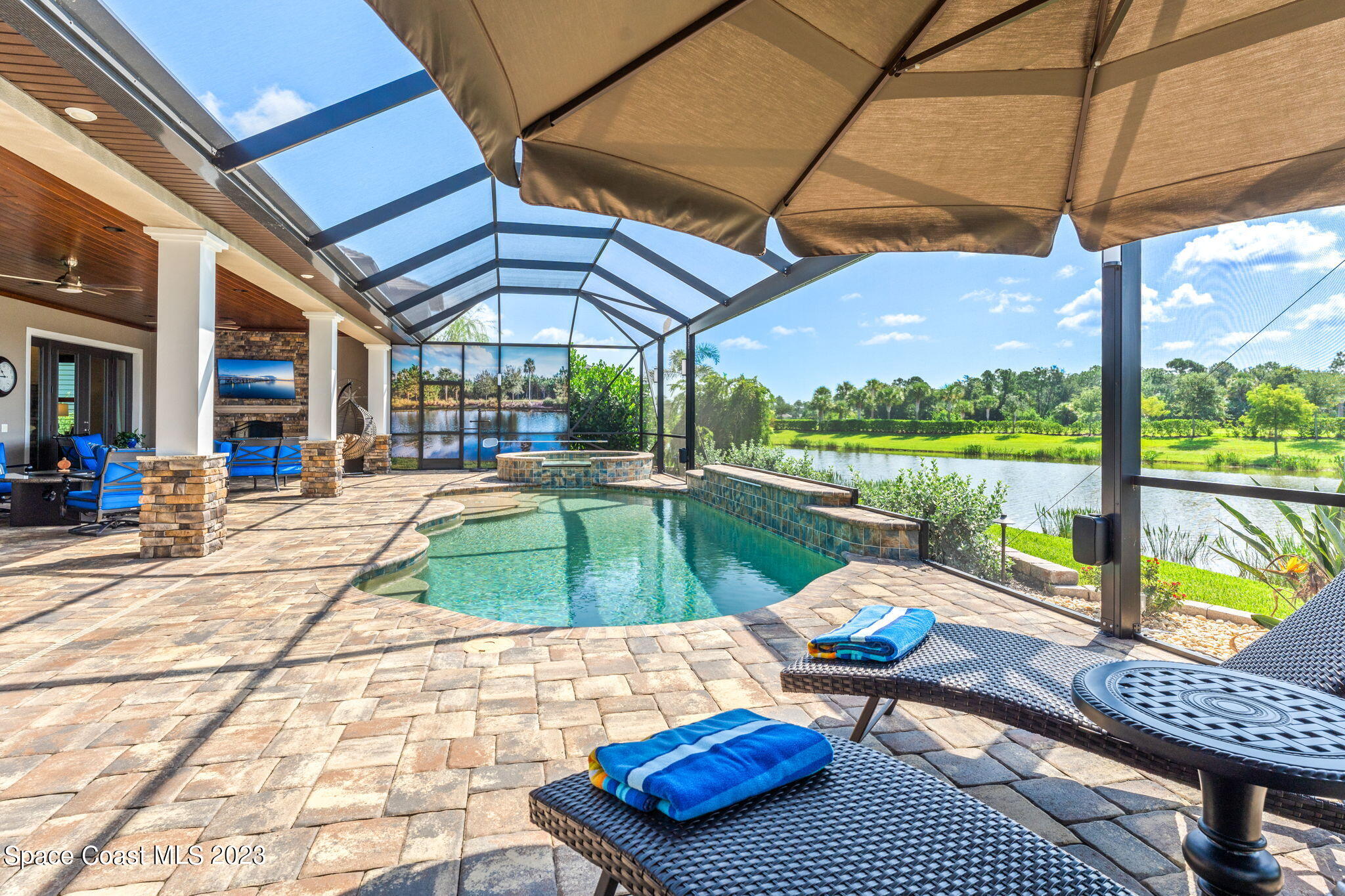 8429 Serrano Circle Melbourne, FL 32940 - Photo 19 of 28 a patio with pool table and chairs